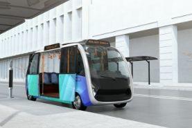 Self-autonomous driving shuttle bus stopping at a bus stop