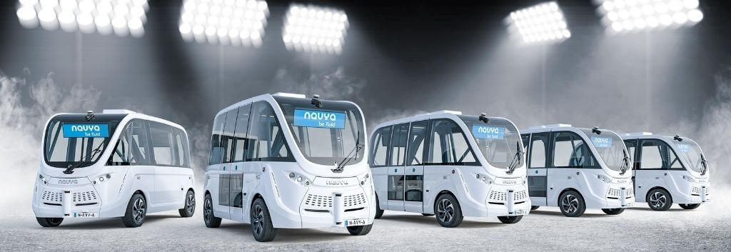 Five ARMA autonomous driving shuttle buses lined up in a row
