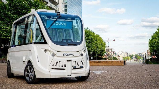 Five ARMA autonomous driving shuttle buses lined up in a row