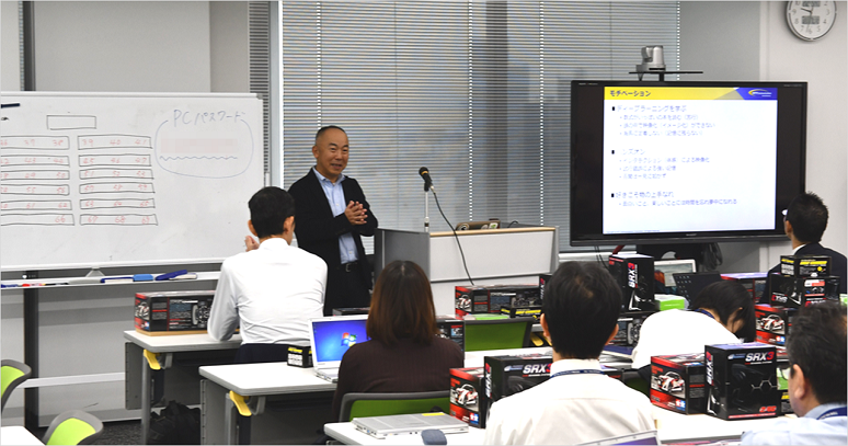 Atsushi Sasaki of NTT Com Engineering Co., Ltd. giving a speech